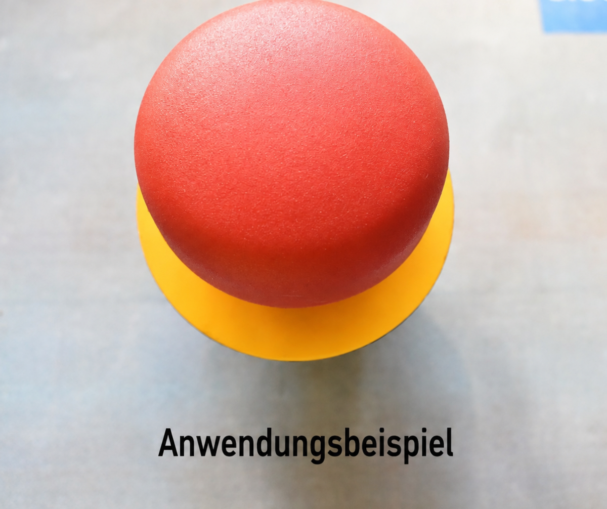Roter Not-Aus-Taster mit gelbem Kennzeichnungsring als Anwendungsbeispiel